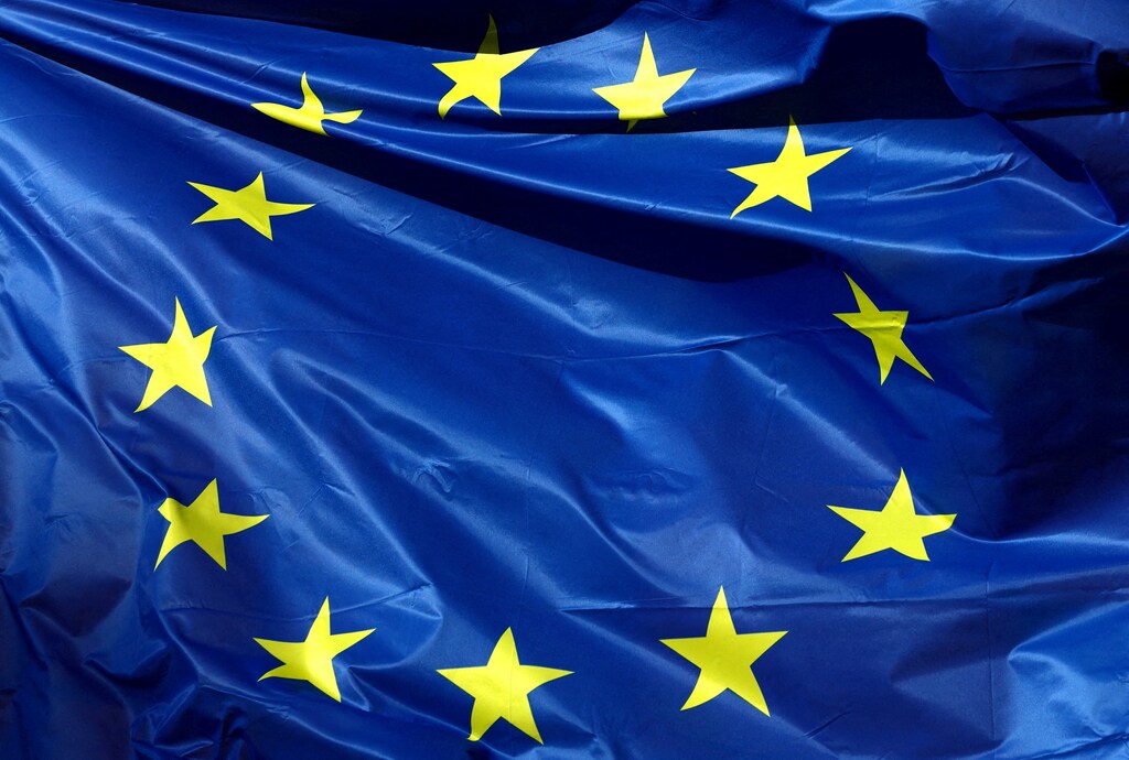 A European Union flag flutters outside the EU Commission headquarters, in Brussels, Belgium, February 1, 2023: Europe must embrace a middle ground between overreliance on foreign partners and total autonomy