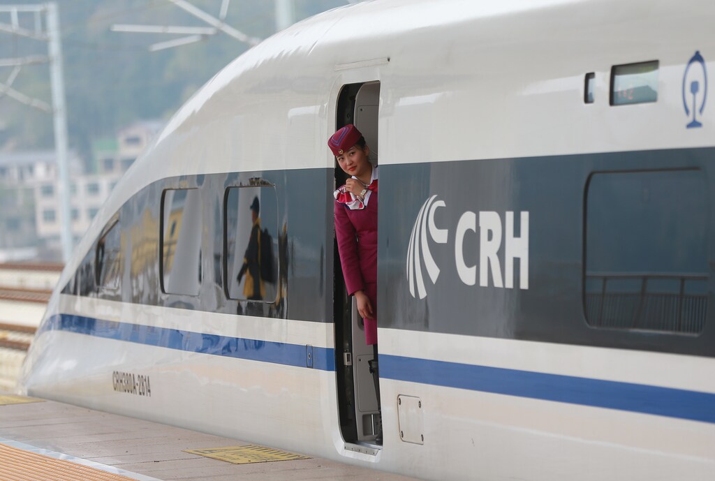 A staff looks out from a high-speed railway train linking Shanghai and Kunming, of Yunnan province, after a partial operation, in Guanling, Guizhou province, China, December 28, 2016. Picture taken December 28, 2016. China Daily/via REUTERS ATTENTION EDITORS - THIS IMAGE WAS PROVIDED BY A THIRD PARTY. EDITORIAL USE ONLY. CHINA OUT. - RTX2WSSP