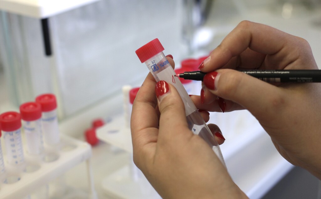 Specialist Zane Zeile marks test tubes at the Institute of Food Safety, Animal Health and Environment in Riga June 9, 2011. More than 1,600 people have been infected by a toxic strain of the Escherichia coli (E.coli) bacteria that has killed at least 17 and may be the deadliest yet in human history. Latvian government officials on Thursday informed media of stringent monitoring and control over its food sources, and the country has yet to be hit with any E.coli related cases. REUTERS/Ints Kalnins (LATVIA - Tags: ENVIRONMENT HEALTH SCI TECH) - RTR2NHLA