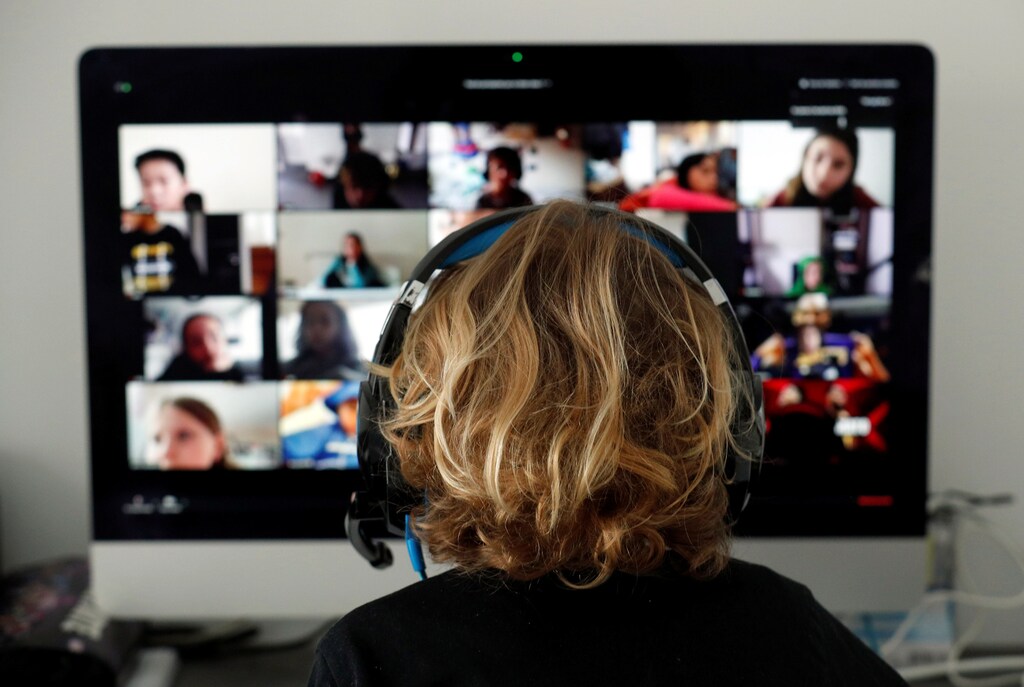 A student takes classes online with his companions using the Zoom APP at home during the coronavirus disease (COVID-19) outbreak in El Masnou, north of Barcelona, Spain April 2, 2020. REUTERS/ Albert Gea - RC2BWF9YUQ65