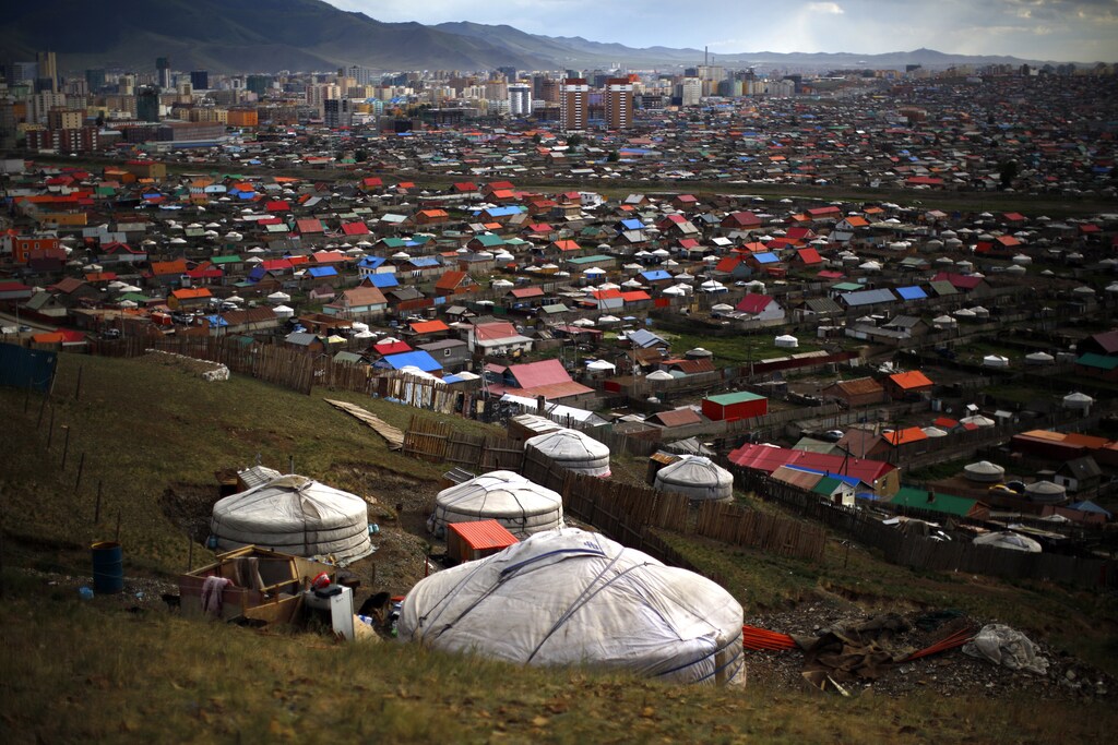 Gers, traditional Mongolian tents, are seen on a hill in an area known as a ger district in Ulan Bator June 28, 2013.