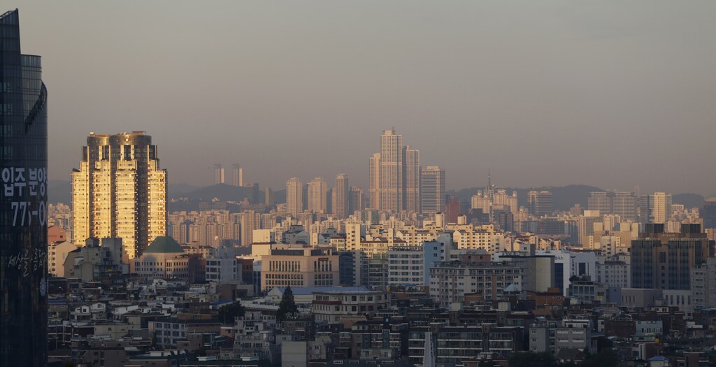 The skyline of central Seoul is seen during sunrise in Seoul September 2, 2013. REUTERS/Lee Jae-Won
