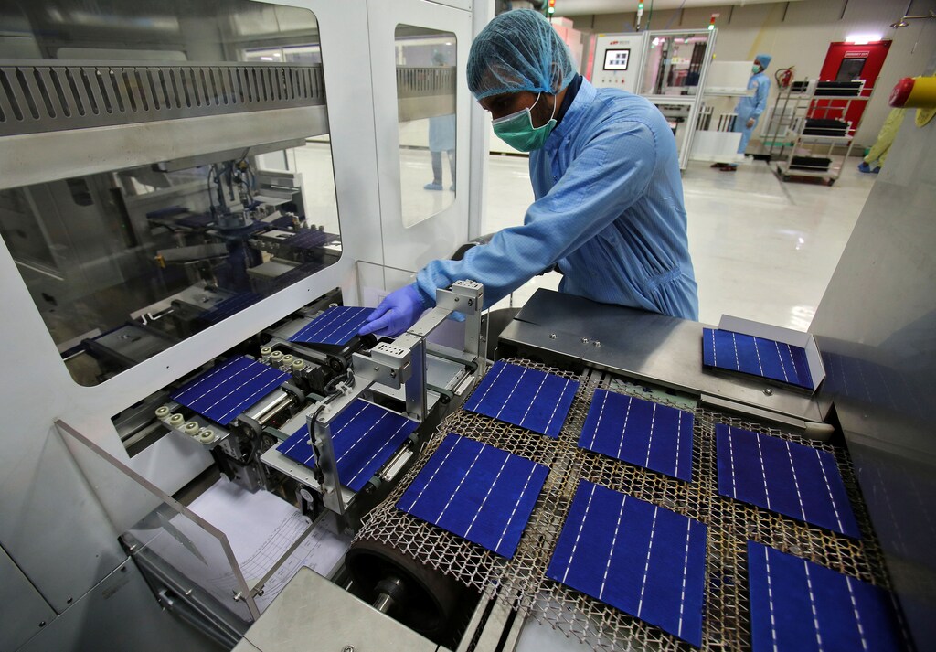 An employee works at a solar cell production line at Jupiter Solar Power Limited (JSPL) plant in Baddi, in the northern state of Himachal Pradesh, India May 29, 2017. Picture taken May 29, 2017. REUTERS/Ajay Verma - RC11E19D6400