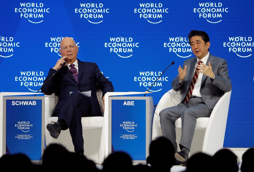 Japanese Prime Minister Shinzo Abe and Executive Chairman of the WEF Klaus Schwab attend the World Economic Forum (WEF) annual meeting in Davos, Switzerland, January 23, 2019. REUTERS/Arnd Wiegmann - RC1C4176BCC0