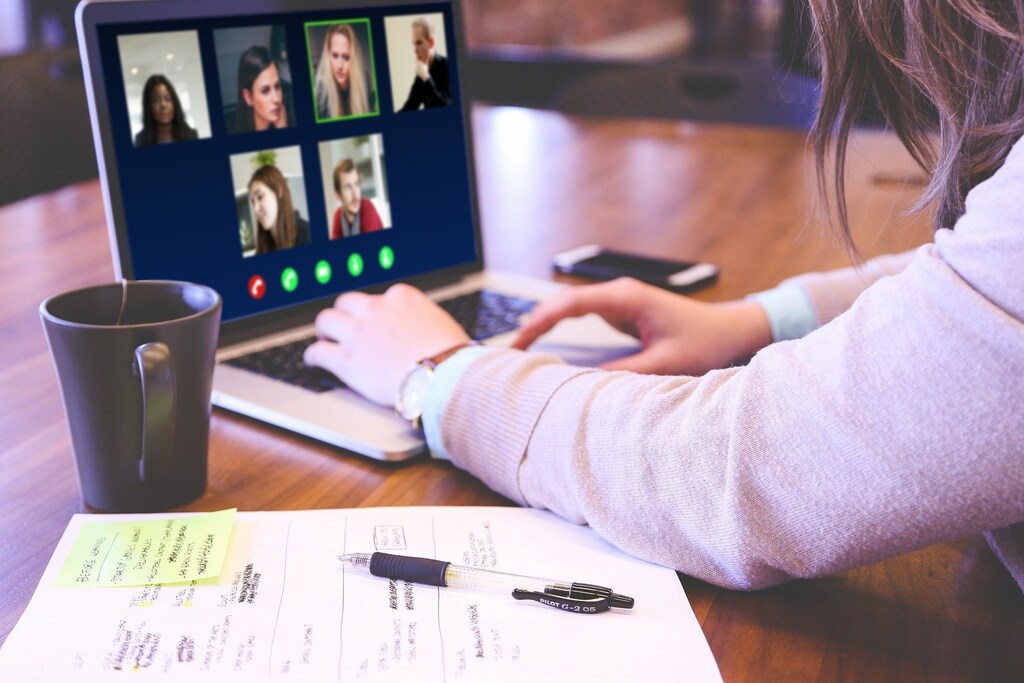 remote working, like this woman on a video call is doing here, can make it harder to resolve conflict at work