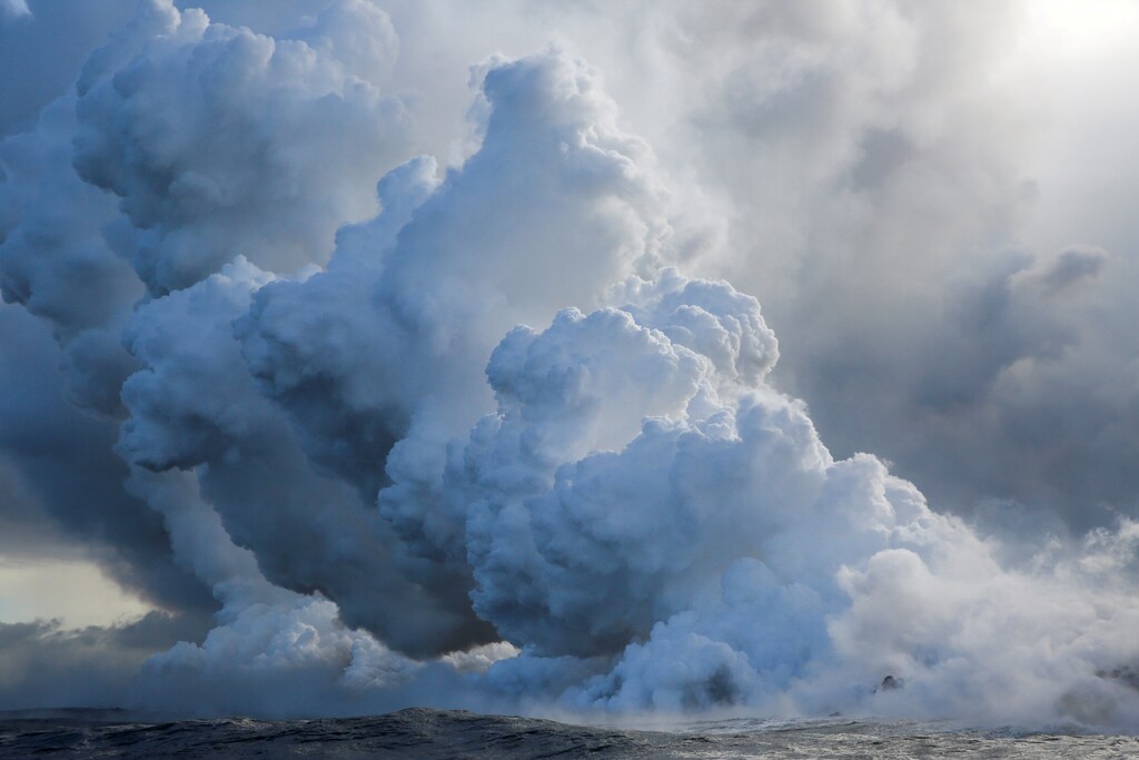 Lava flows into the Pacific Ocean southeast of Pahoa during ongoing eruptions of the Kilauea Volcano in Hawaii, U.S., May 20, 2018. REUTERS/Terray Sylvester TPX IMAGES OF THE DAY - RC1A79073650