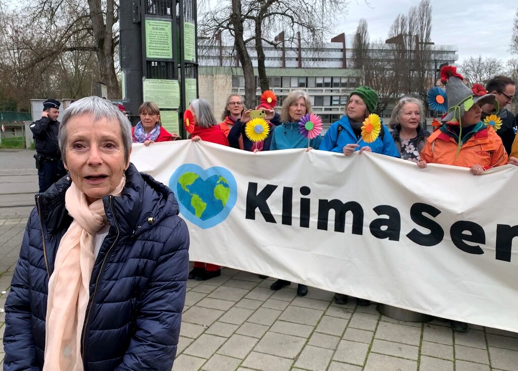 Anne Mahrer, co-president of the Senior Women for Climate Protection, stands in front of supporters outside the European Court of Human Rights in Strasbourg, France March 29, 2023. REUTERS/Emma Farge
