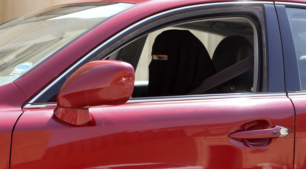 A woman drives a car in Saudi Arabia October 22, 2013. A conservative Saudi Arabian cleric has said women who drive risk damaging their ovaries and bearing children with clinical problems, countering activists who are trying to end the Islamic kingdom's male-only driving rules. Saudi Arabia is the only country in the world where women are barred from driving, but debate about the ban, once confined to the private sphere and social media, is increasingly spreading to public forums too. REUTERS/Faisal Al Nasser (SAUDI ARABIA - Tags: POLITICS SOCIETY TRANSPORT) - RTX14JLI