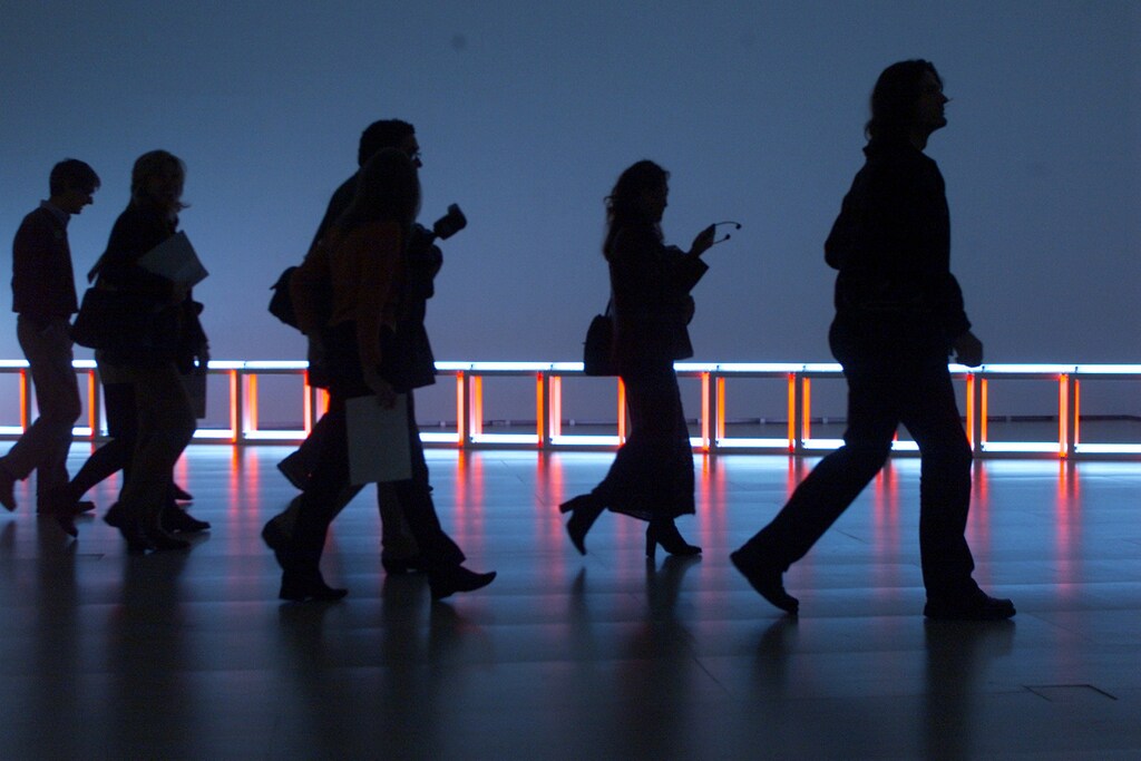 Visitors walk past "An artificial barrier of blue and red flourescent light", created by New York's artist Dan Flavin, during a preview of the Panza Collection of minimalist, conceptual, post-minimalist and enviromental art exhibition at Bilbao's Guggenheim Museum November 17, 2000.The exhibiton, which will open from November 18, 2000 until March 2001, features works of 23 artists,including Sol de Witt, Richard Serra and Richard Long.SP - RTRAWZQ