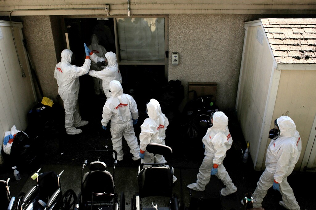 Members of a cleaning crew high-five before entering the Life Care Center of Kirkland, the Seattle-area nursing home at the epicenter of one of the biggest coronavirus outbreaks in the United States, in Kirkland, Washington, U.S. March 12, 2020 Coronavirus china virus health healthcare who world health organization disease deaths pandemic epidemic worries concerns Health virus contagious contagion viruses diseases disease lab laboratory doctor health dr nurse medical medicine drugs vaccines vaccinations inoculations technology testing test medicinal biotechnology biotech biology chemistry physics microscope research influenza flu cold common cold bug risk symptomes respiratory china iran italy europe asia america south america north washing hands wash hands coughs sneezes spread spreading precaution precautions health warning covid 19 cov SARS 2019ncov wuhan sarscow wuhanpneumonia pneumonia outbreak patients unhealthy fatality mortality elderly old elder age serious death deathly deadly