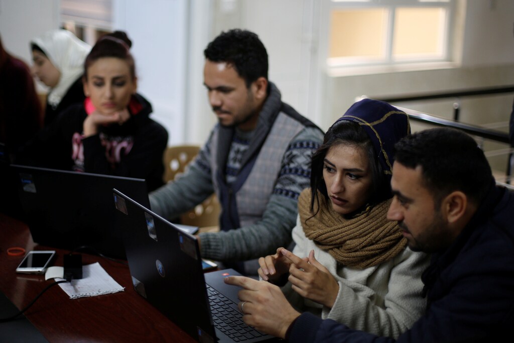 Syrian refugees and displaced Iraqis attend their class to learn basic and advanced coding skills at the Re:Coded boot camp, in Erbil, Iraq February 1, 2017. Picture taken February 1, 2017. REUTERS/Muhammad Hamed TPX IMAGES OF THE DAY - RC125482BD10