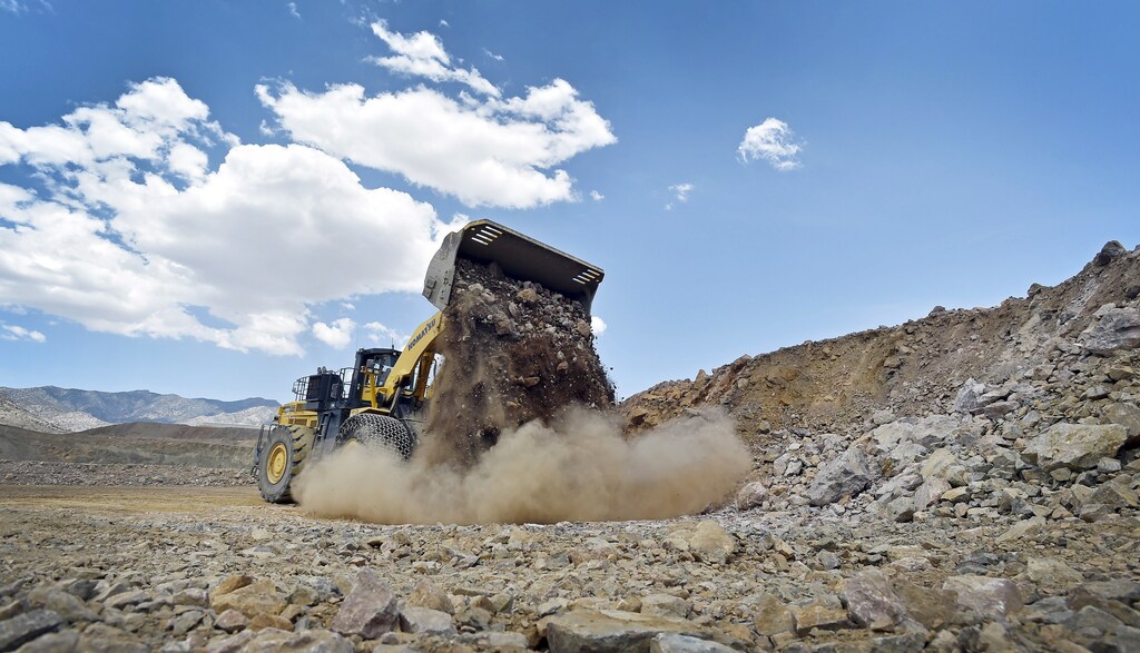 A front-end loader is used to move material inside the open pit at Molycorp's Mountain Pass Rare Earth facility in Mountain Pass, California June 29, 2015. REUTERS/David Becker
