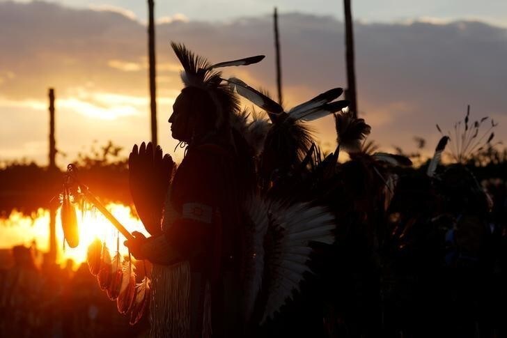 Dancers take part in the Grand Entry on the opening night of the 32nd Annual Taos Pueblo Pow Wow, a Native American dance competition and social gathering, in Taos, New Mexico, U.S., July 7, 2017. Picture taken July 7, 2017. REUTERS/Brian Snyder TPX IMAGES OF THE DAY