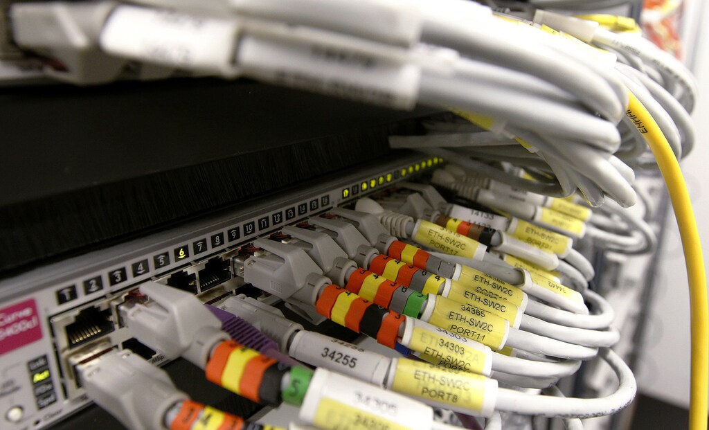 Plugged in lan cables are seen in a server room of the SRG SSR (Swiss radio and television) in the Federal Palace Media Centre in Bern February 27, 2012. REUTERS/Pascal Lauener (SWITZERLAND - Tags: MEDIA SCIENCE TECHNOLOGY) - LR2E82S135Y1W
