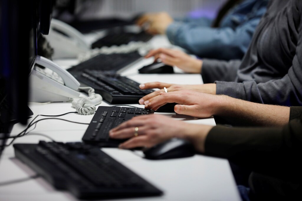 Employees, mostly veterans of military computing units, use keyboards as they work at a cyber hotline facility at Israel's Computer Emergency Response Centre (CERT) in Beersheba, southern Israel February 14, 2019. Picture taken February 14, 2019. REUTERS/Amir Cohen - RC1E423B2710