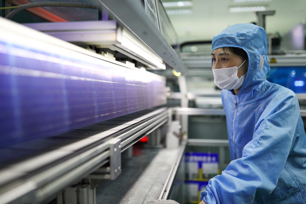 An employee works at a solar panel production line of Shenzhou New Energy Co Ltd in Lianyungang, Jiangsu province, China March 15, 2018. Picture taken March 15, 2018