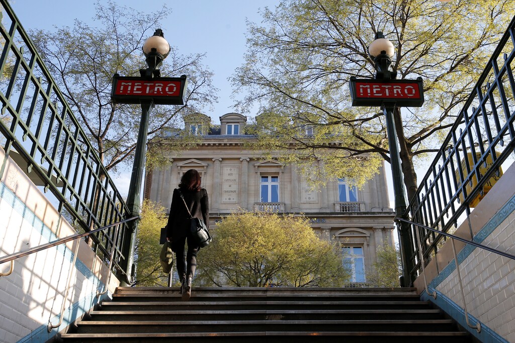 A woman leaves a metro entrance at the Chatelet station in Paris, France, March 28, 2017. Picture taken March 28, 2017. REUTERS/Vincent Kessler - RTX35KOQ
