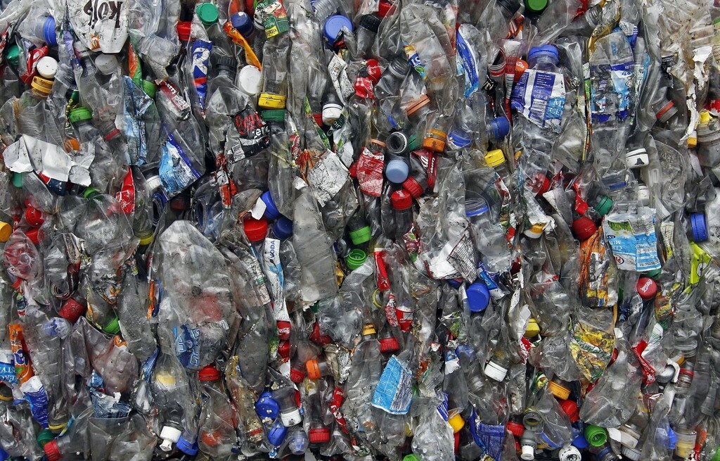 Pressed plastic bottles are seen at a dumping ground in Uholicky village, near Prague April 10, 2013. REUTERS/Petr Josek (CZECH REPUBLIC - Tags: ENVIRONMENT SOCIETY) - RTXYIL6