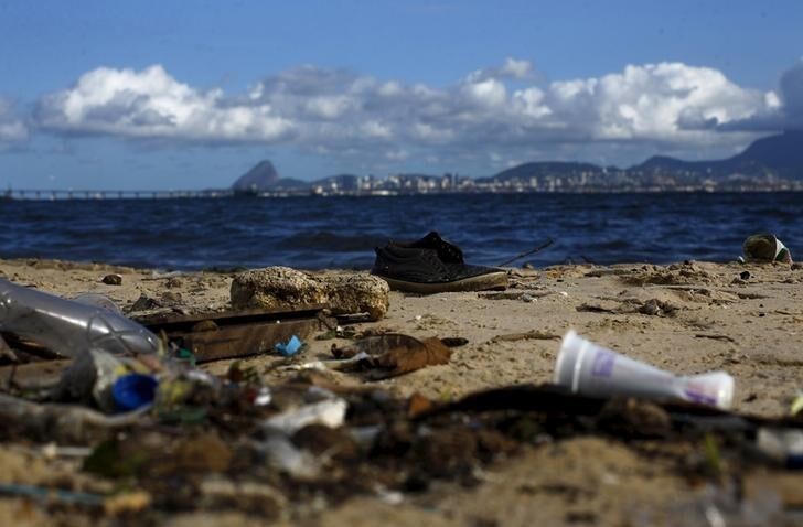 Rubbish is pictured at Bica beach, on the banks of the Guanabara Bay, with the Sugar Loaf mountain in background, 500 days ahead the Rio 2016 Olympic Games in Rio de Janeiro March 24, 2015. As part of its Olympic bid, Rio promised to clean up 80 percent of the bay for the games. But local government officials have already admitted that a cleanup by 2016 is not achievable. Despite millions of dollars of investment over the years, the bay still stinks of sewage. Sailors who visited the city for test events complained of a floating sofa and a dead dog in the water. To match OLYMPICS-BRAZIL/RUBBISH REUTERS/Ricardo Moraes