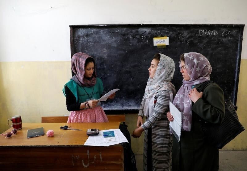 Afghan women arrive at a voter registration centre to register for the upcoming parliamentary and district council elections in Kabul, Afghanistan April 23, 2018.