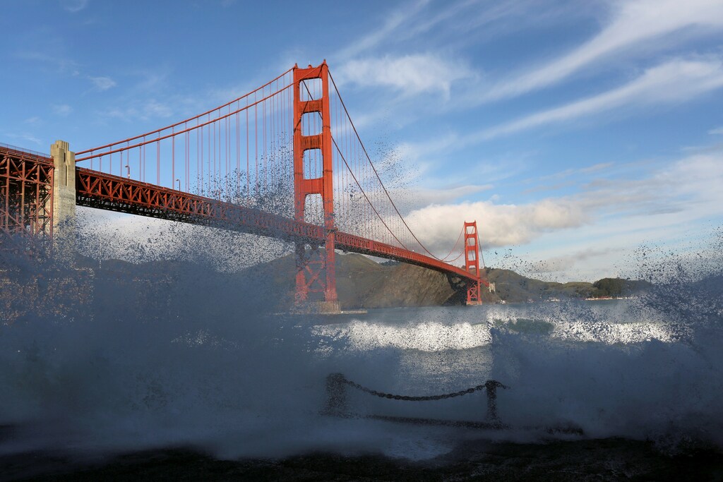 Waves crash against a sea wall in San Francisco Bay beneath the Golden Gate Bridge in San Francisco, California December 16, 2014. REUTERS/Robert Galbraith/File Photo GLOBAL BUSINESS WEEK AHEAD PACKAGE SEARCH BUSINESS WEEK AHEAD 10 OCT FOR ALL IMAGES - RTSRJ2L
