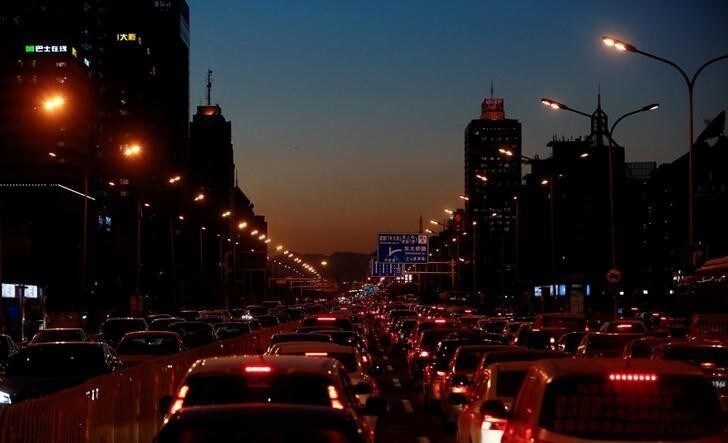 Cars stand bumper to bumper in the evening rush hour traffic jam in central Beijing, China, December 8, 2016. REUTERS/Thomas Peter/File Photo