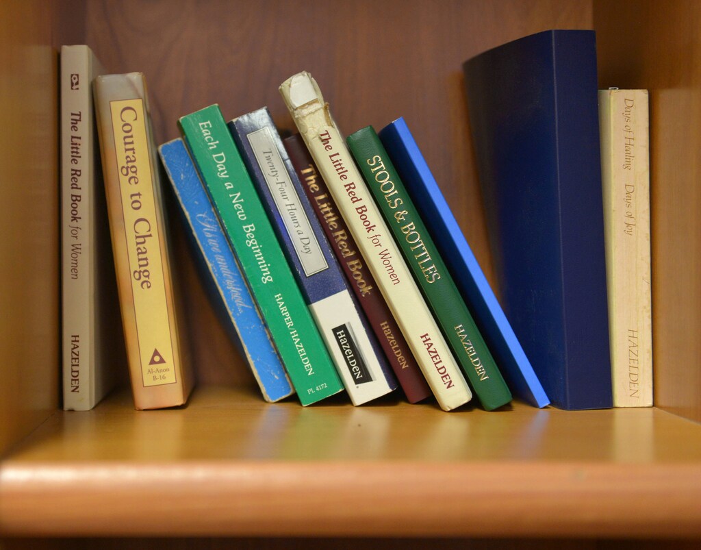 Books on sobriety lie on a shelf in the break room at the Barnett Community Center in Huntington, West Virginia, U.S. May 4, 2017. REUTERS/Lexi Browning - RTS1580O