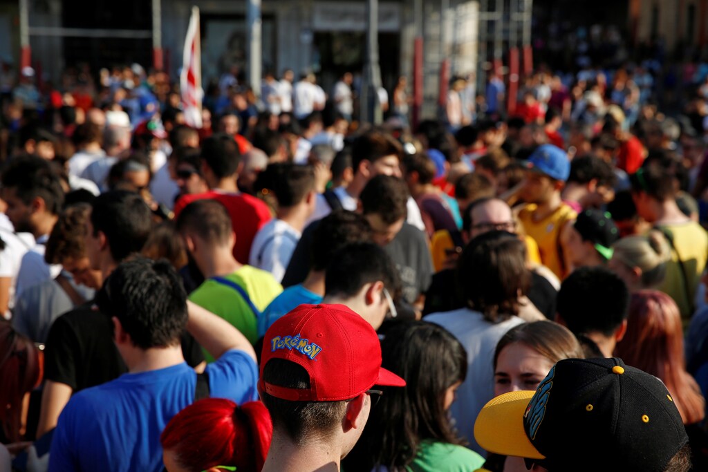 A young man is seen wearing a "Pokemon" cap as people gather to play the augmented reality mobile game "Pokemon Go" by Nintendo at Puerta del Sol square in Madrid, Spain July 28, 2016. REUTERS/Sergio Perez - D1BETSFPBCAA