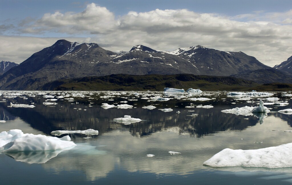 Icebergs are reflected in the waters of Eriks Fjord near the town of Narsarsuaq in southern Greenland