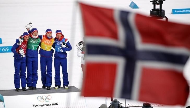 Cross-Country Skiing - Pyeongchang 2018 Winter Olympics - Women's 4x5km Relay - Alpensia Cross-Country Skiing Centre - Pyeongchang, South Korea - February 17, 2018. Gold medalists Ingvild Flugstad Oestberg, Astrid Uhrenholdt Jacobsen, Ragnhild Haga and Marit Bjoergen of Norway celebrate during the victory ceremony. REUTERS/Carlos Barria