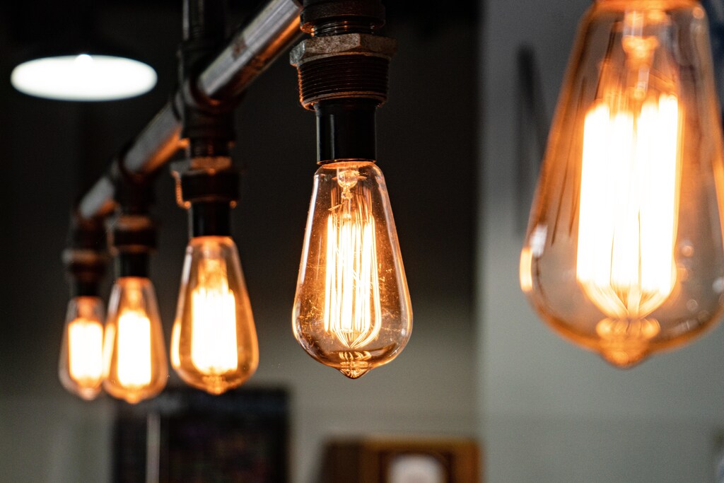 Five lightbulbs hanging from fixture.