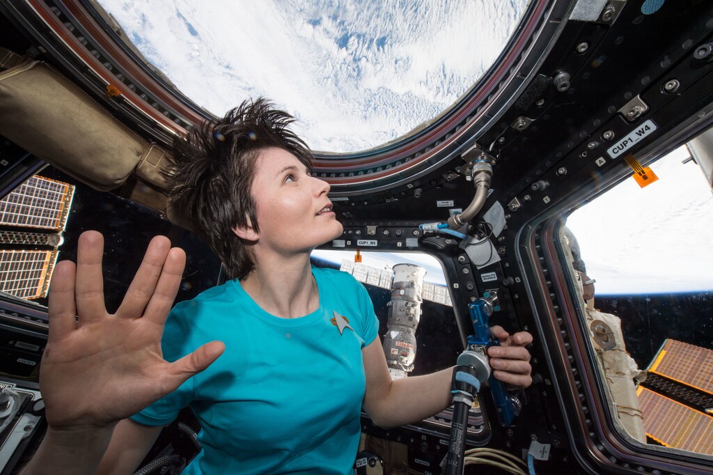 (February 28, 2015) --- Samantha Cristoforetti flashes the Vulcan Salute in the cupola of the space station in honor of the late Leonard Nimroy.