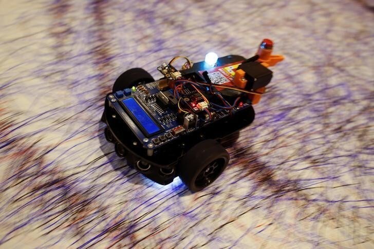 A robot drawing car is seen during the Web Summit, Europe's biggest tech conference, in Lisbon, Portugal, November 9, 2017. REUTERS/Pedro Nunes