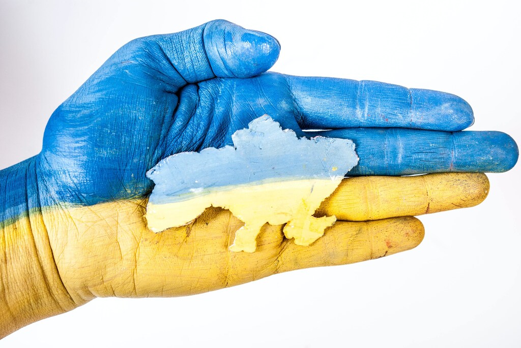 Hand decorated with a ukraine flag: Millions are seeking to live new lives after fleeing Ukraine following the Russian invasion.