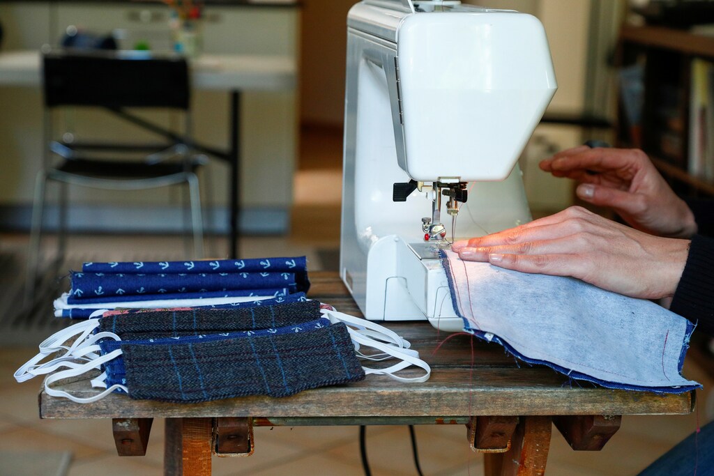 Belgian Audrey Jacques, fashion designer and sewing teacher, sews homemade protective masks to be donated to relatives during the coronavirus lockdown, imposed by the Belgian government in an attempt to slow down the spread of COVID-19, in Brussels, Belgium March 23, 2020. REUTERS/Francois Lenoir - RC2UPF98ZEJ8
