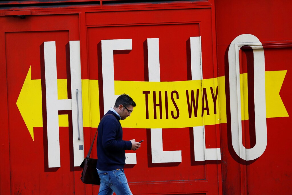 A man looks at his mobile phone in Shoreditch, London, Britain October 5, 2016. REUTERS/Stefan Wermuth SEARCH "WERMUTH PHONES" FOR THIS STORY. SEARCH "THE WIDER IMAGE" FOR ALL STORIES - RTSU6NZ