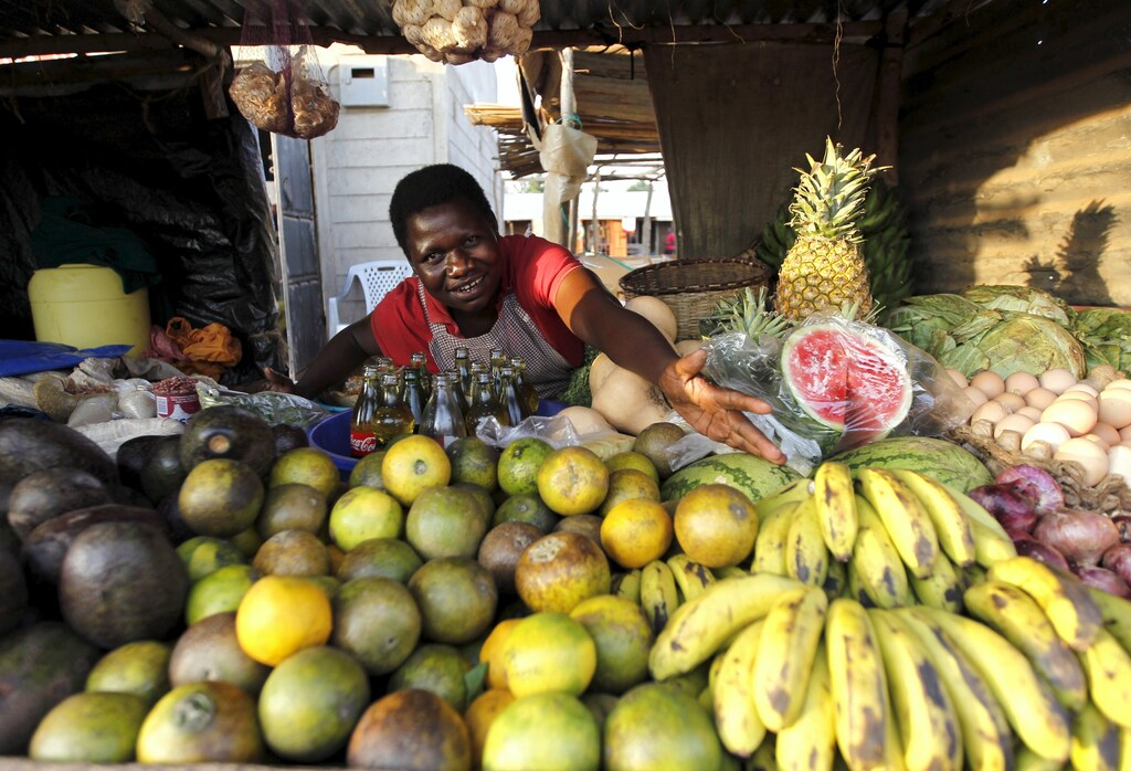 Imelda Akinyi, 25, arranges fruit at her stall in Kogelo, west of Nairobi, Kenya