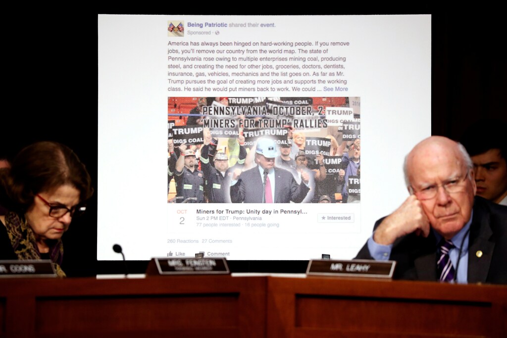 U.S. Senator Dianne Feinstein (D-CA) (L) and Senator Pat Leahy (D-VT) show a fake social media post for a non-existent "Miners for Trump" rally as representatives of Twitter, Facebook and Google testify before a Senate Judiciary Crime and Terrorism Subcommittee hearing on how Russia allegedly used their services to try to sway the 2016 U.S. elections, on Capitol Hill in Washington, U.S. October 31, 2017. REUTERS/Jonathan Ernst - RC1621AB3470