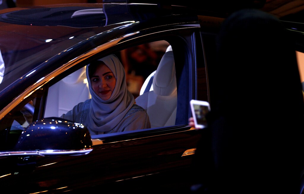 A Saudi woman is photographed as she checks a car at a showroom in Riyadh, Saudi Arabia October 5, 2017. REUTERS/Faisal Al Nasser TPX IMAGES OF THE DAY - RC1801BA7260