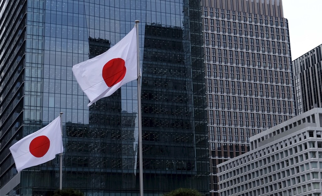 Japanese national flags flutter in front of buildings at Tokyo's business district in Japan, February 22, 2016. Growth in Japan's manufacturing activity slowed sharply in February as new export orders contracted at the fastest pace in three years, a worrying sign that overseas demand is deteriorating rapidly as China's economy slows, a preliminary survey showed on Monday. REUTERS/Toru Hanai TPX IMAGES OF THE DAY - GF10000318199