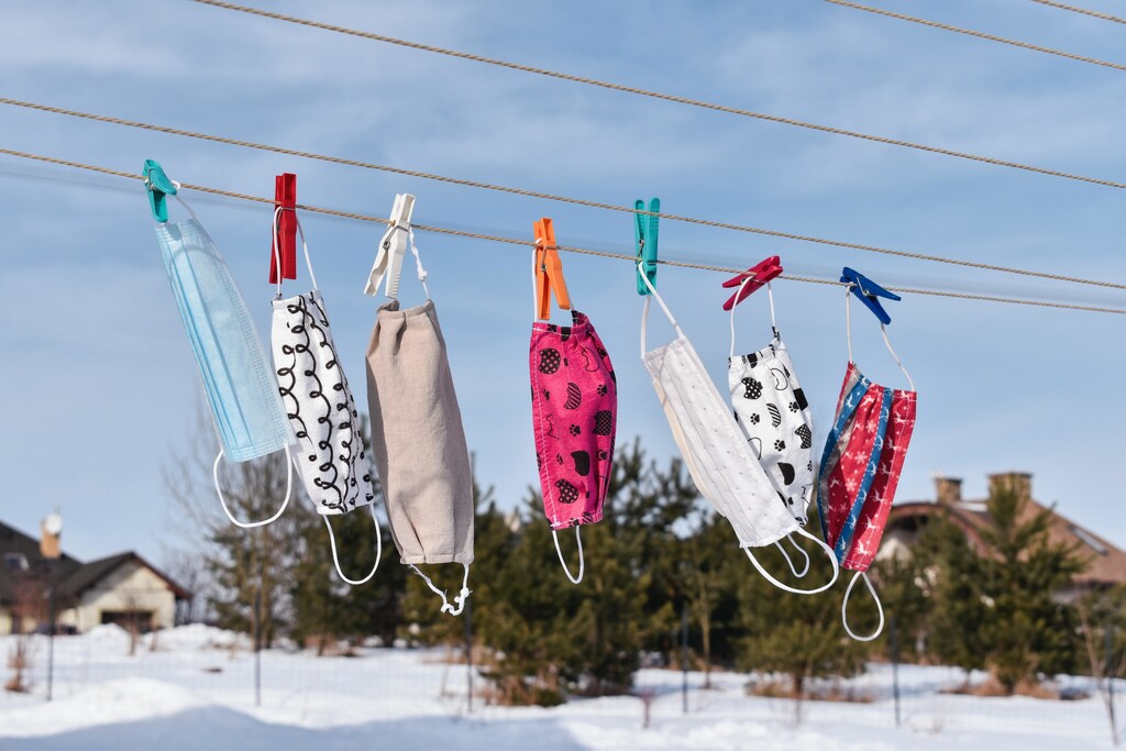 A selection of masks pegged on to a clothes line.