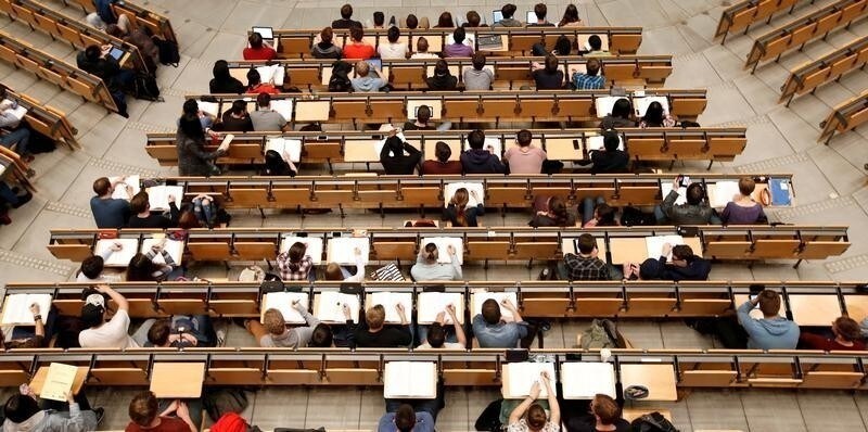 Students attend a lecture in the auditorium of Technical University of Munich 'Technische Universitaet Muenchen' TUM in Munich, Germany, May 25, 2016.