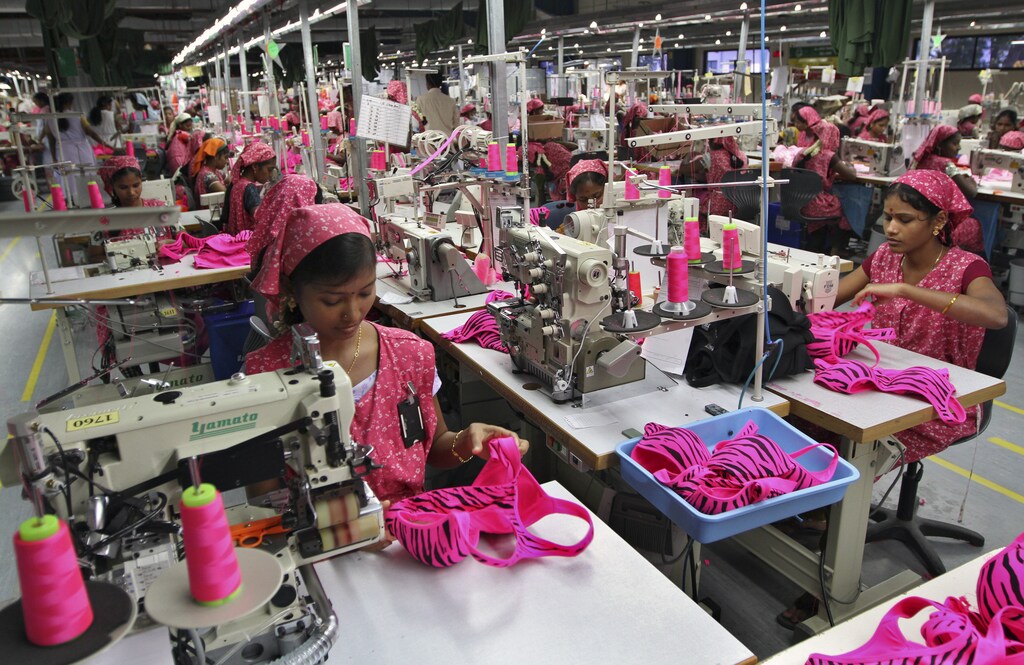 Workers produce bras for export at the Intimate Fashions factory in Kanchipuram district, 30 km (18 miles) south of the India's southern city of Chennai, May 22, 2012. For conservative India's rural women, a project giving them jobs in the manufacturing sector is not just an end to poverty, but brings empowerment and respect in this deeply patriarchal society. Intimate Fashions - which produces bras for Victoria's Secret and the La Senza brand - is one of thousands of firms that have set up in Tamil Nadu's Kanchipuram district in recent years. To match INDIA-WOMEN/EMPOWERMENT REUTERS/Babu (INDIA - Tags: BUSINESS EMPLOYMENT TEXTILE) - GM1E85M1O3Z01