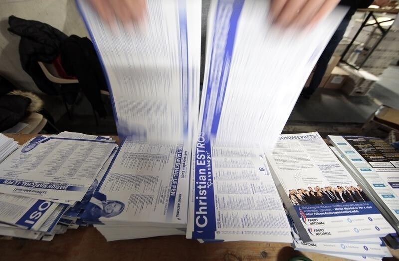 A civil servant prepares electoral documents for the upcoming second round of the regional elections in the Provence-Alpes-Cote d'Azur (PACA), in Nice, France