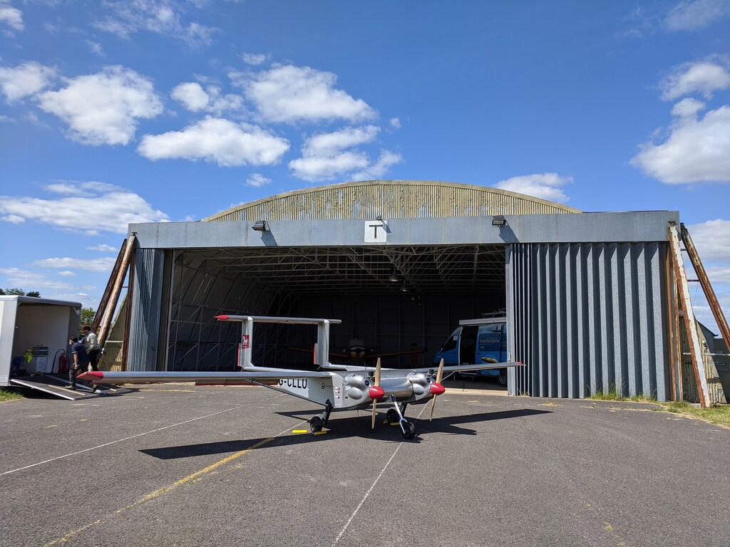 A fixed-wing, twin-engined UAV (unmanned aerial vehicle) is seen in front of a hangar at Lee-on-Solent airport, Britain May, 12, 2020.