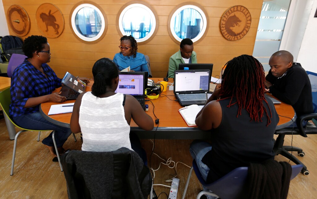Entrepreneurs work on their projects at Nailab, a Kenyan firm that supports technology startups, behind the latest initiative, which targets entrepreneurs for their ideas on providing sex education through technology and social media in Nairobi, Kenya, July 4, 2016. REUTERS/Thomas Mukoya - D1BETNPEWNAB
