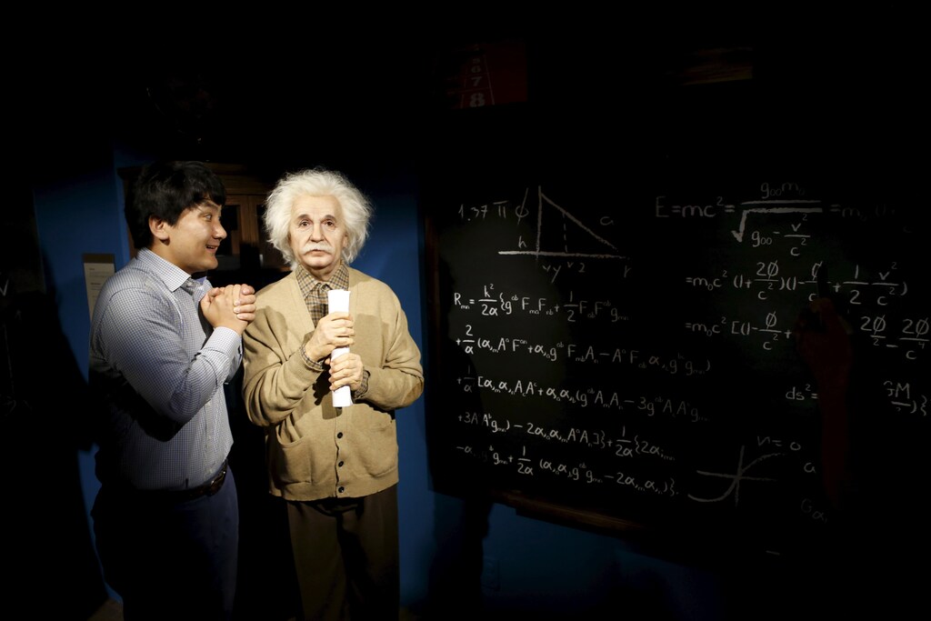 A man jokes next to the wax figure of Albert Einstein at Grevin Wax Museum in central Seoul, South Korea, July 30, 2015. French wax museum Musee Grevin has opened its first Asian branch in central Seoul with about 80 wax figures including hallyu (the Korean pop culture wave) displayed, according to local media.