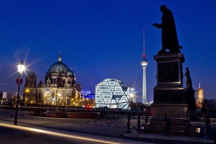The Berliner Dom (Berlin Cathedral), the Humboldt Box exhibition space and Fernsehturm television tower and the statue of agronomist Albrecht Thaer (L-R) are seen at night in Berlin March 21, 2012. REUTERS/Thomas Peter (GERMANY - Tags: CITYSCAPE)