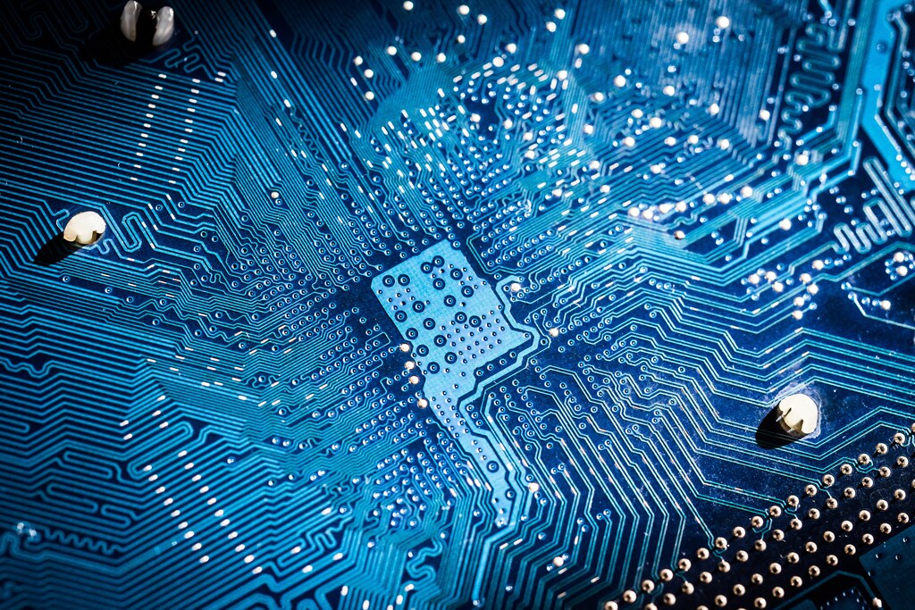 Electronic circuit board close up. blue PCB; semiconductor industry, chips