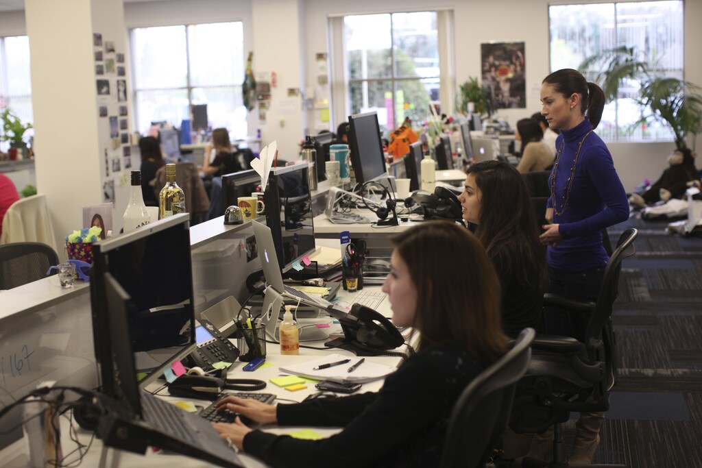 Employees work at the headquarters of Box.net, an online file sharing and Cloud content management service for enterprise companies, in Los Altos, California February 5, 2013. Startups often thrive on a lack of rules and boundaries. But experts say that as they make the transition from a handful of people in a room to sizeable businesses, the hazards of operating without manual - including lawsuits, reputational hits, and waning employee morale - grow exponentially. Picture taken February 5, 2013. To match story STARTUPS-SQUARE/ REUTERS/Robert Galbraith (UNITED STATES - Tags: SCIENCE TECHNOLOGY BUSINESS) - RTR3DMKD